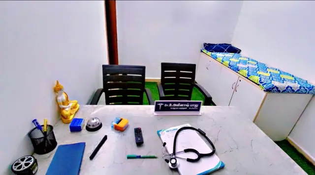 The consultation room: the doctor's desk, two chairs and an examination couch